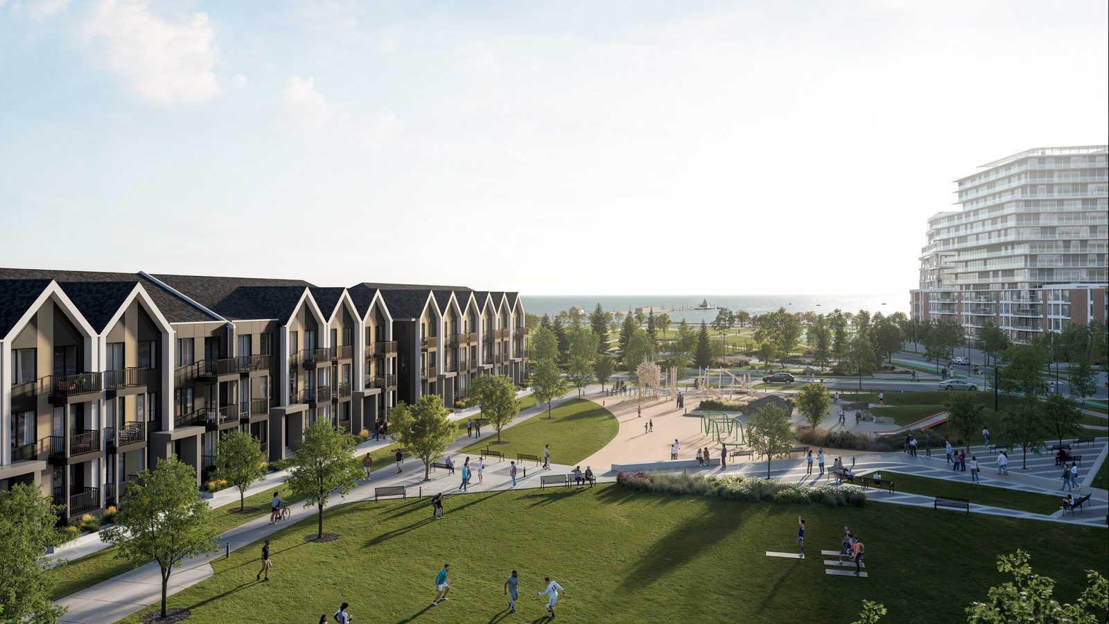 Aura townhomes facing the park, with the waterfront beyond
